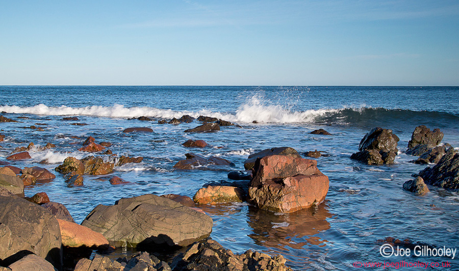 Tide over rocky shore at Burnmouth