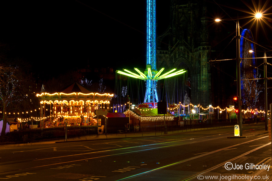 Edinburgh Christmas Attractions 2014 . A view of Princes Street . The Star Flyer with Big Wheel in background