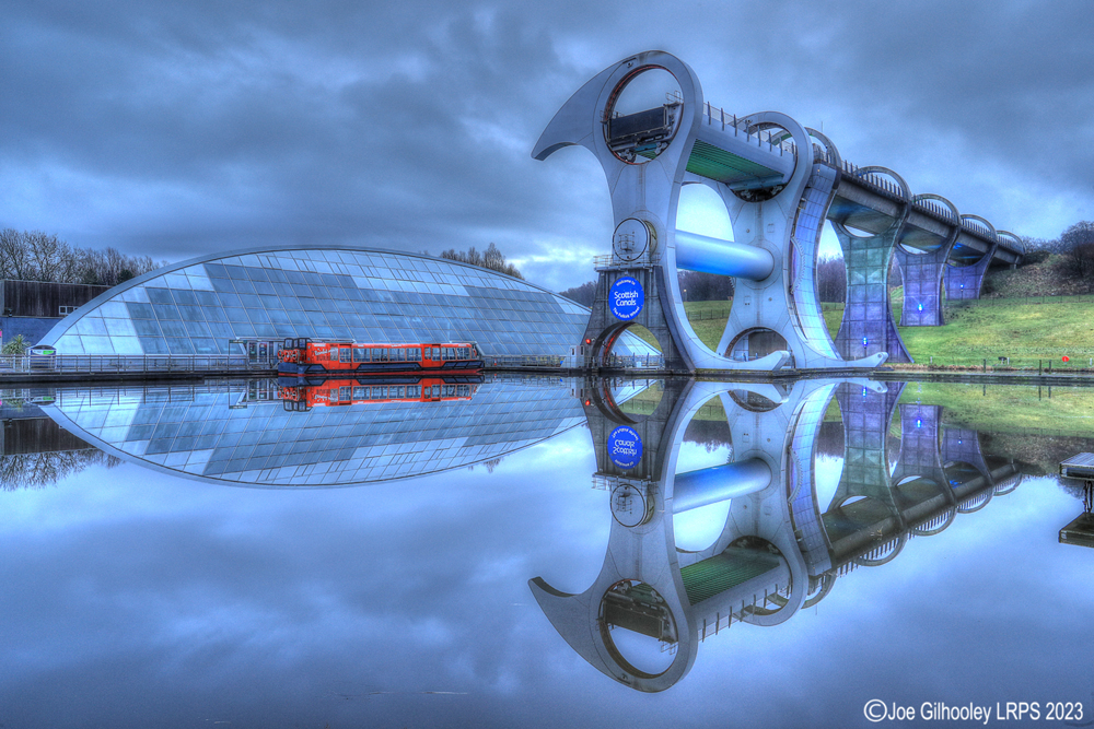 The Falkirk Wheel lights starting to come on