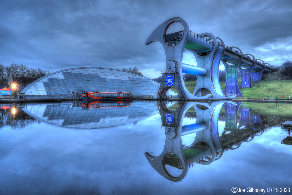 The Falkirk Wheel lights starting to come on