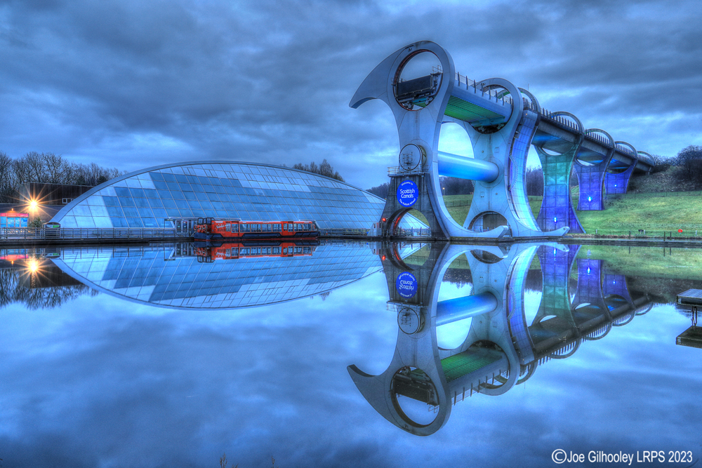 The Falkirk Wheel lights starting to come on