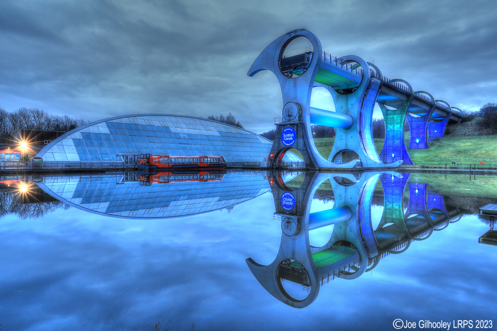 The Falkirk Wheel lights starting to come on