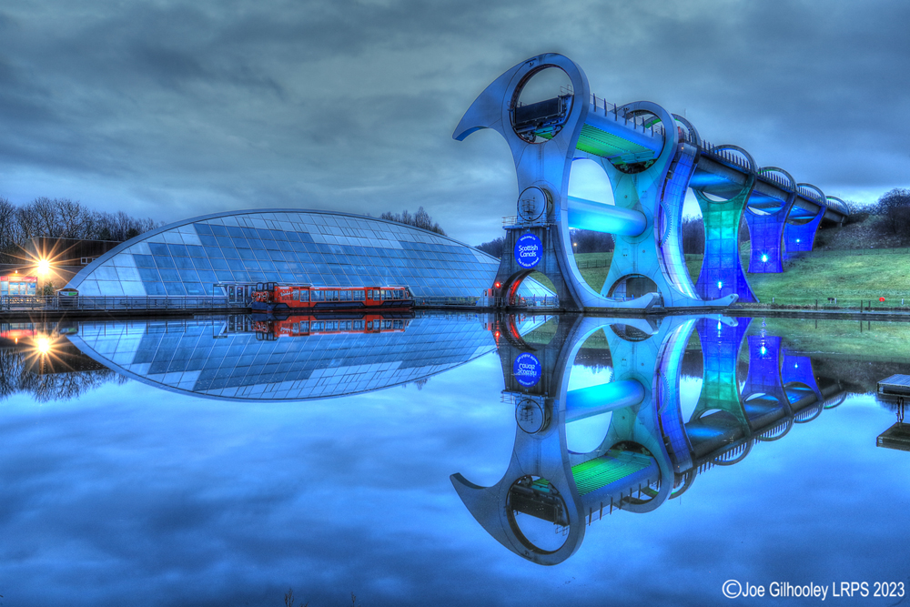 The Falkirk Wheel lights starting to come on