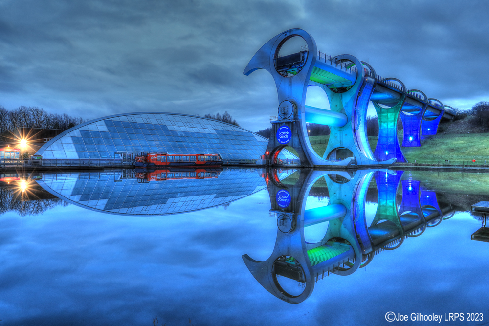 The Falkirk Wheel lights starting to come on