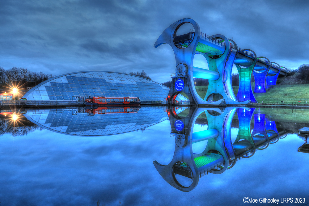 The Falkirk Wheel lights starting to come on