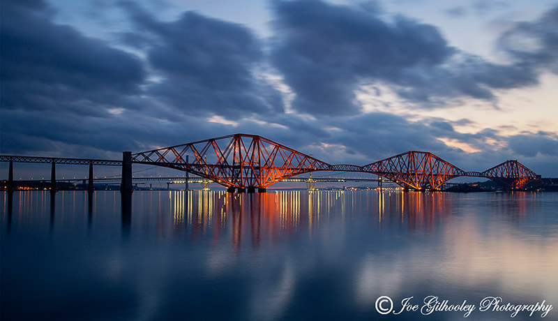 Forth Bridge lit up at night