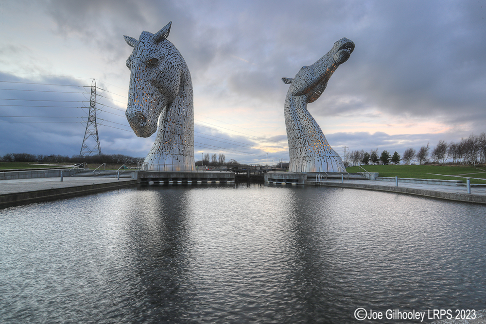 The Kelpies lit at night