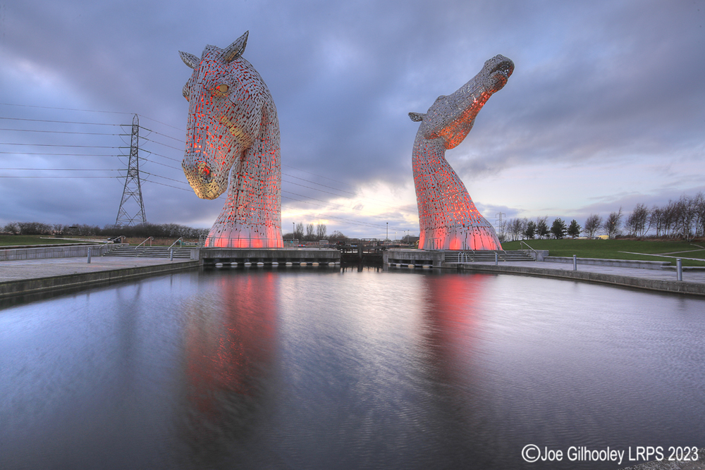 The Kelpies lit at night