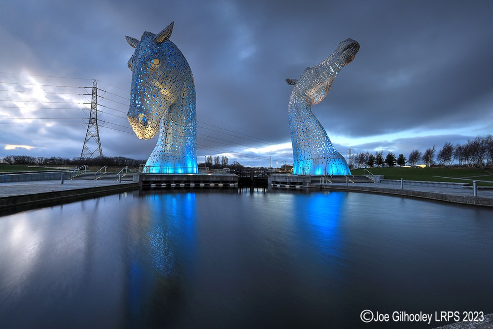 The Kelpies lit at night