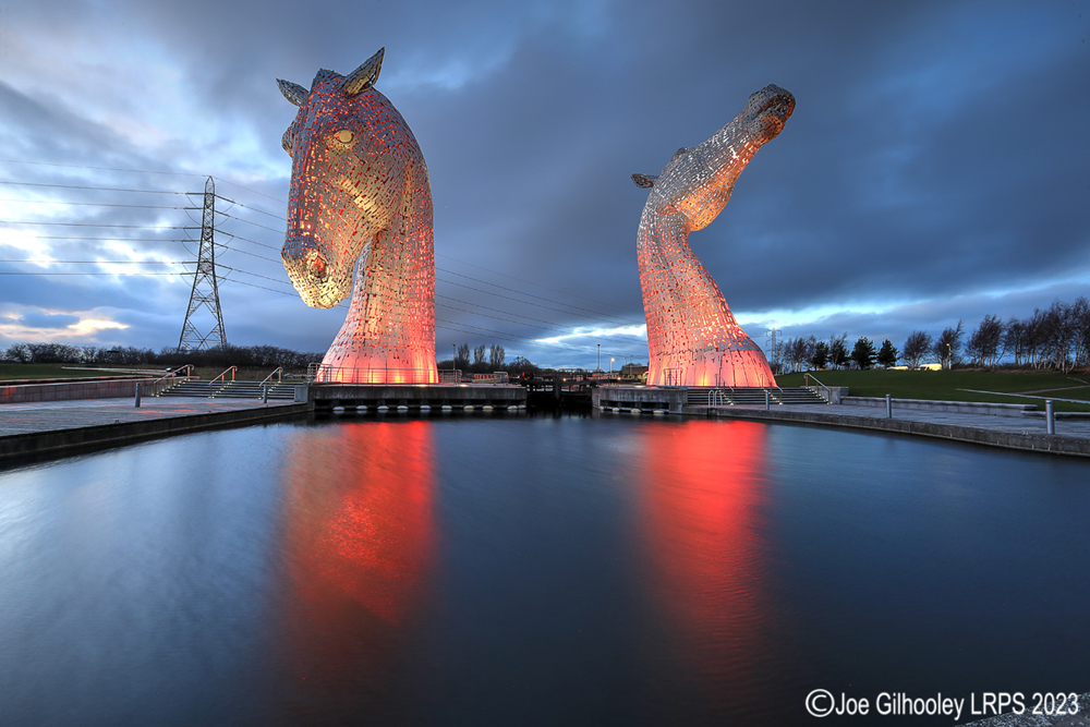 The Kelpies lit at night
