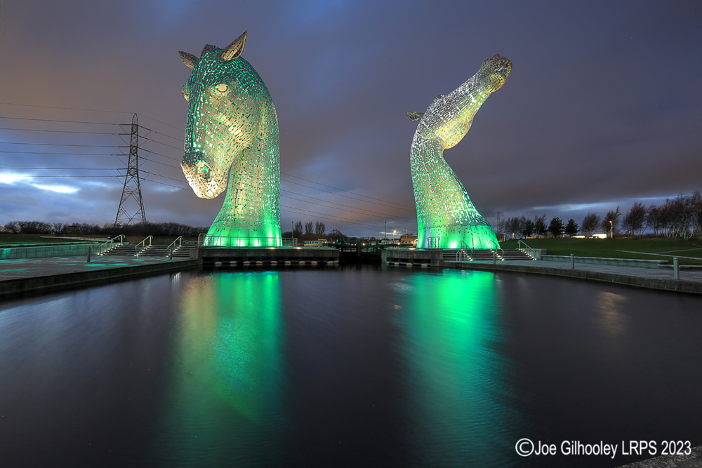 The Kelpies lit at night