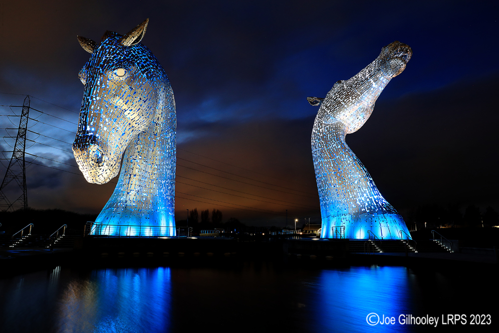 The Kelpies lit at night