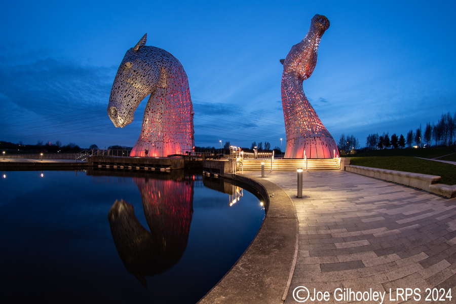 The Kelpies lit at night