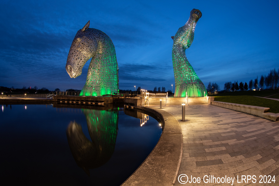 The Kelpies lit at night