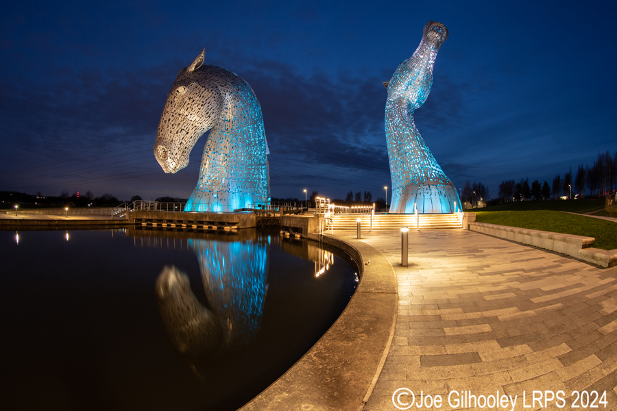 The Kelpies lit at night
