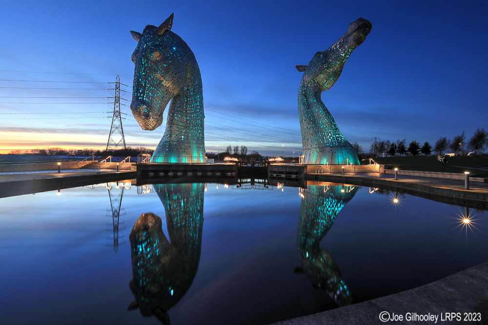 The Kelpies lit at night