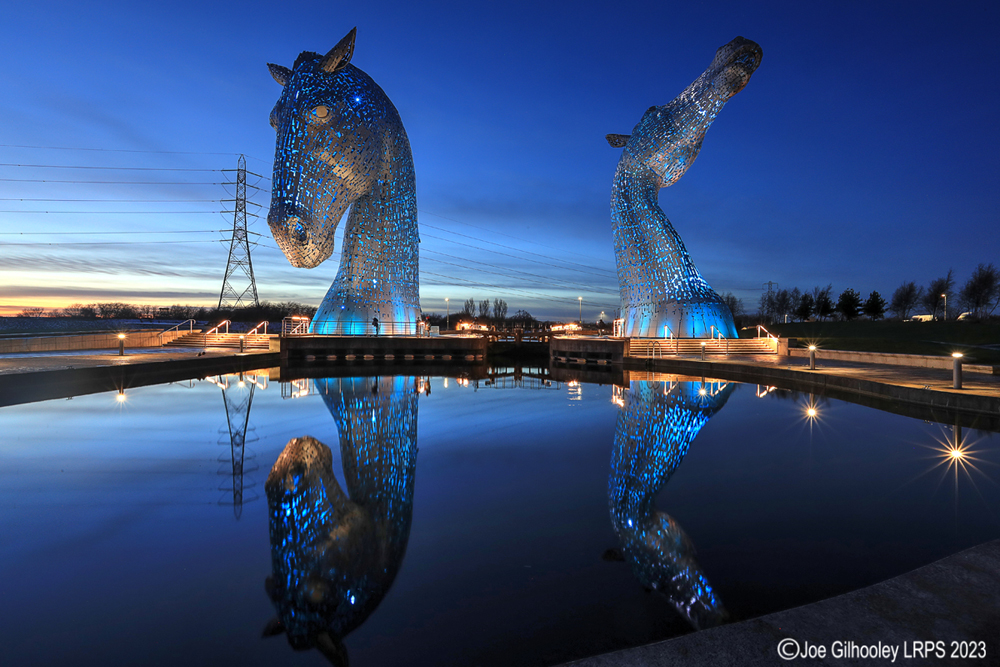 The Kelpies lit at night
