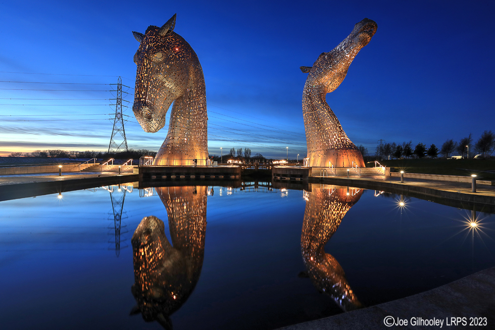 The Kelpies lit at night