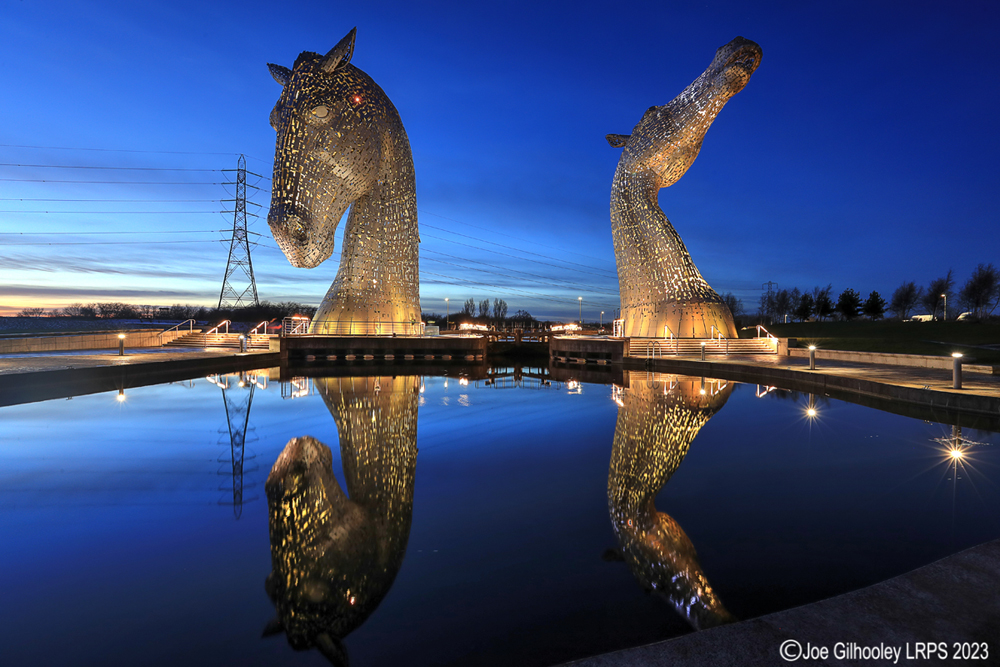 The Kelpies lit at night