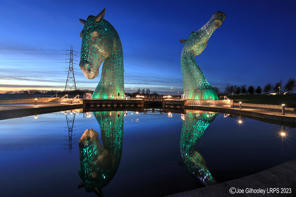 The Kelpies lit at night