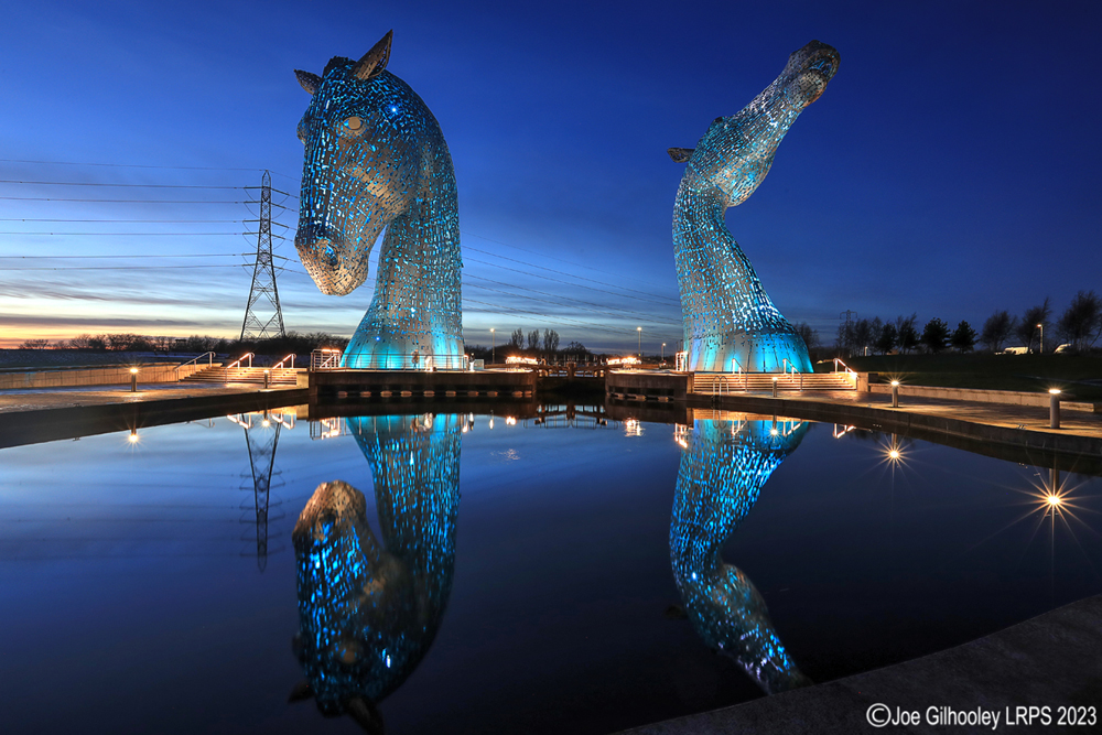 The Kelpies lit at night