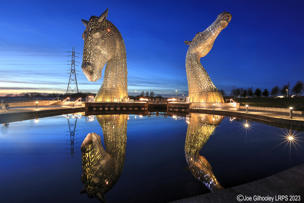 The Kelpies lit at night