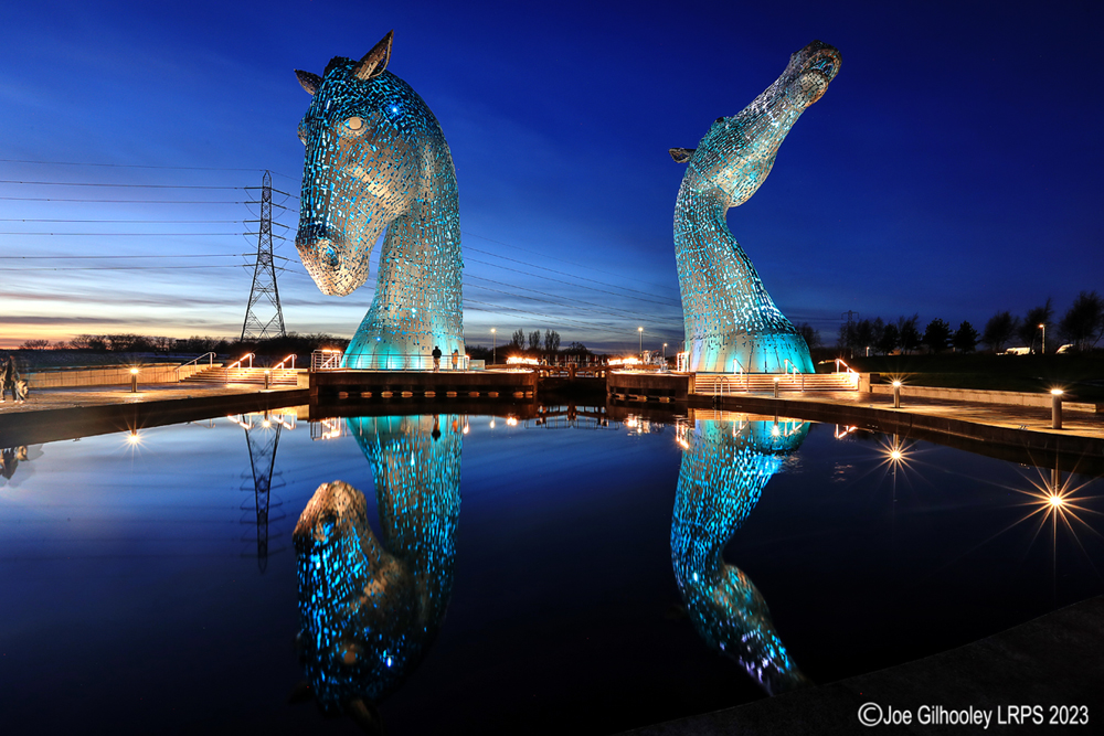 The Kelpies lit at night