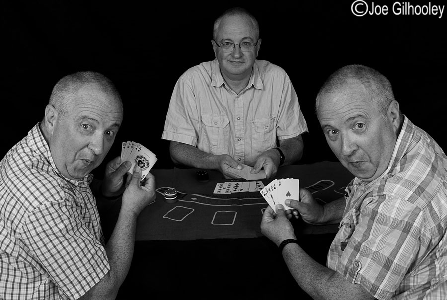 Playing poker - three images blended into one action shot