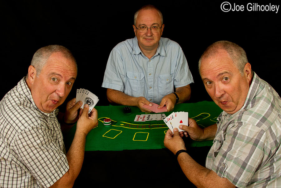 Playing poker - three images blended into one action shot