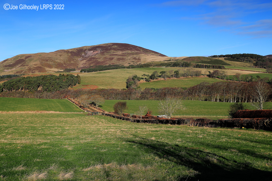 Castlelaw Hill in Pentland Hills with a wonderful winter's blue sky