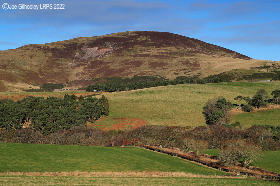 Castlelaw Hill in Pentland Hills with a wonderful winter's blue sky