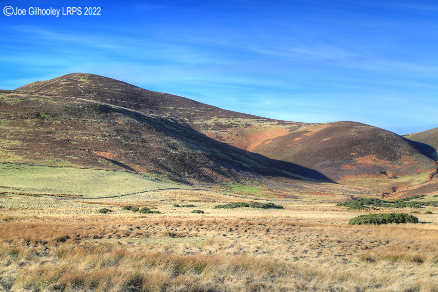 Carnethy Hill in Pentland Hills with a wonderful winter's blue sky