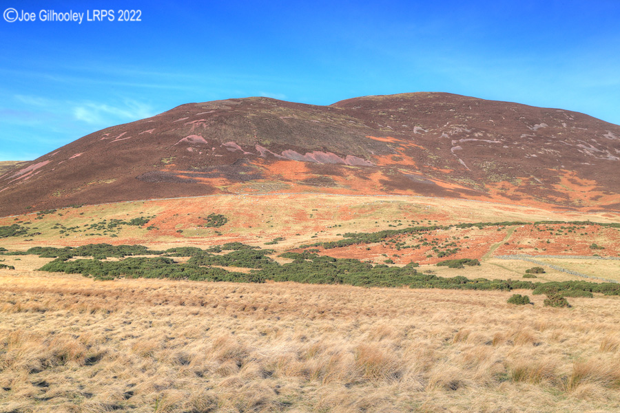 Carnethy Hill in Pentland Hills with a wonderful winter's blue sky