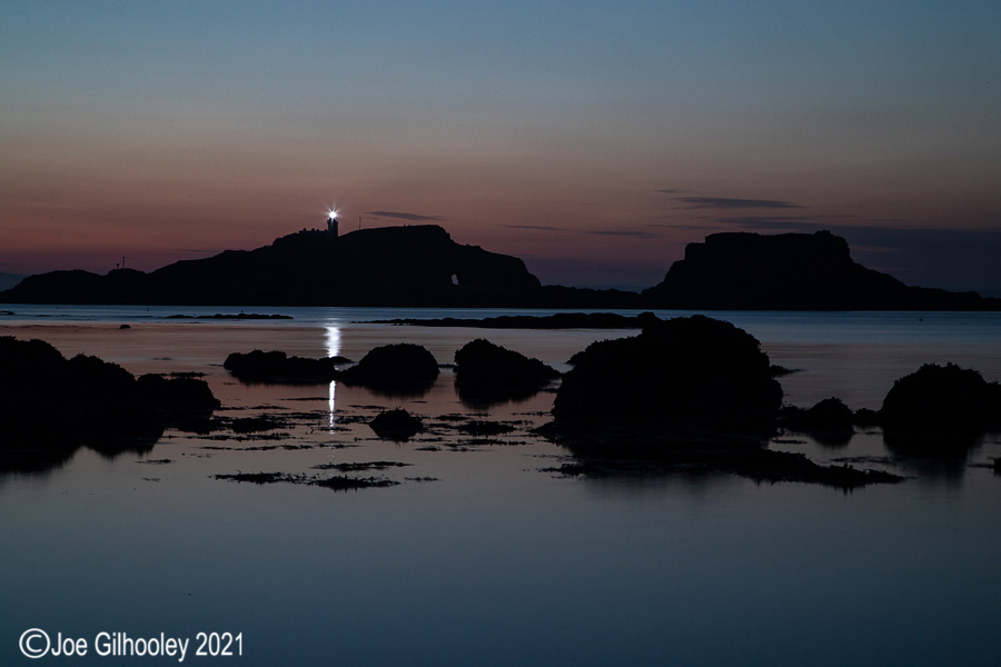 Fidra Island Lighthouse at Yellowcraigs Beach after sunset